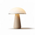 Mushroom-shaped table lamp in cream color with ribbed base and LED bulb
